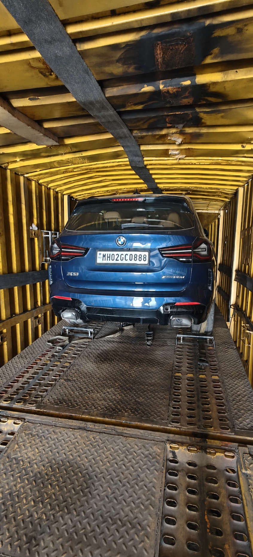 BMW X3, secured inside a sealed container - no road grit, no rain, no prying eyes.