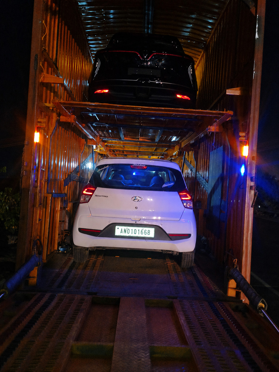 Two decks, two deliveries - a full container headed out at night.