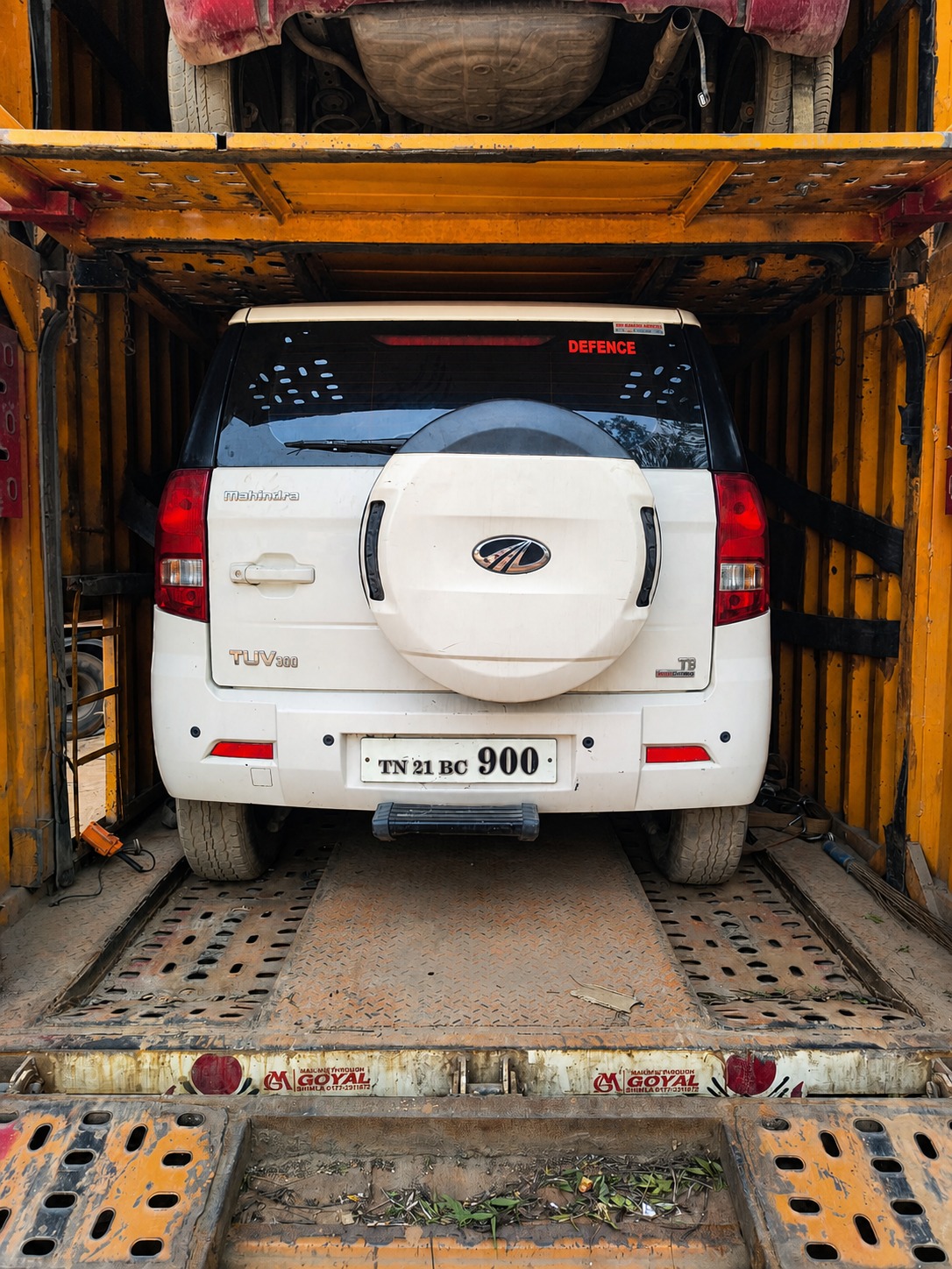 A defence-postings move - Mahindra TUV300, container-loaded.