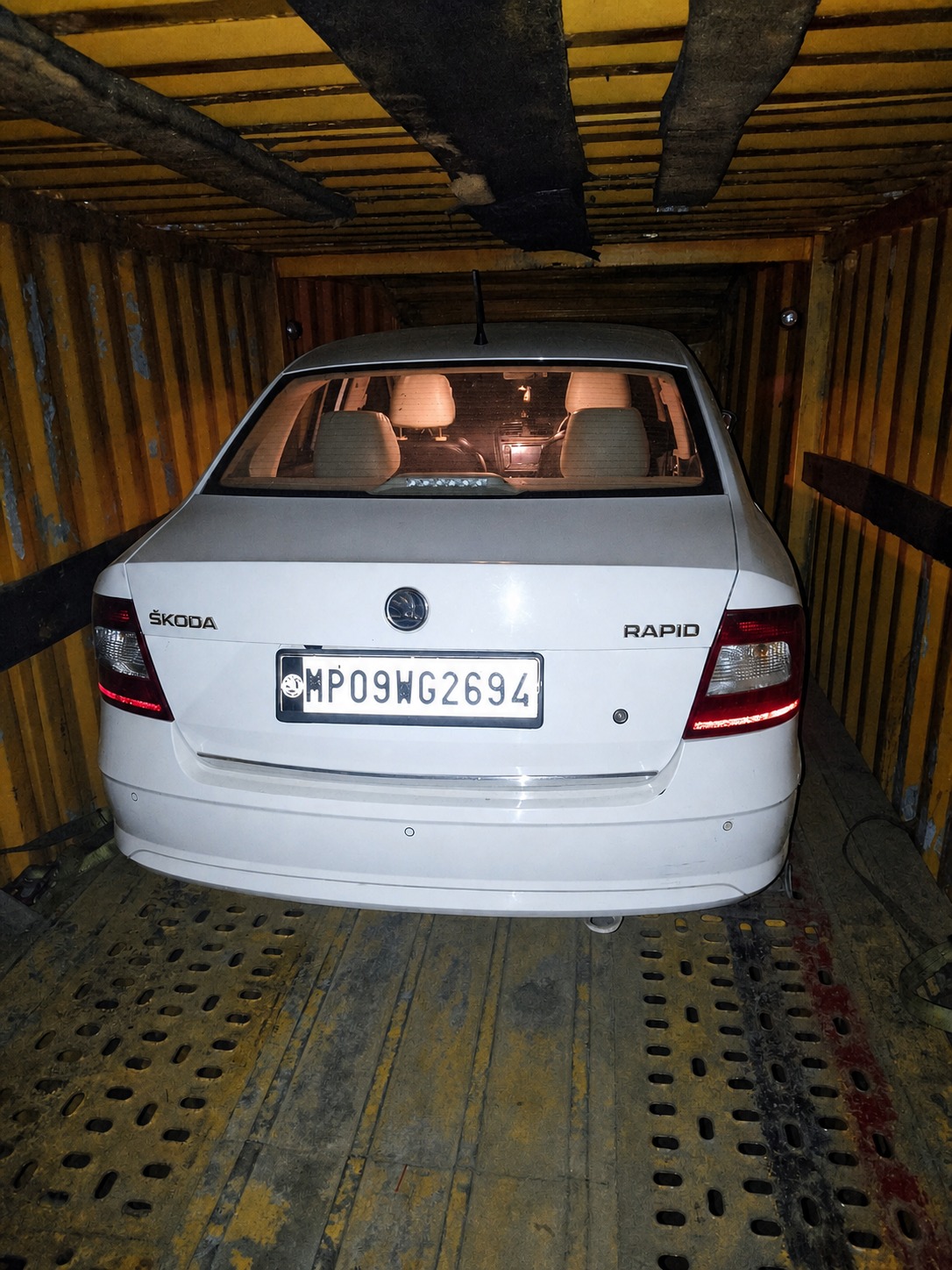 Skoda Rapid, boxed in for an enclosed-carrier delivery.