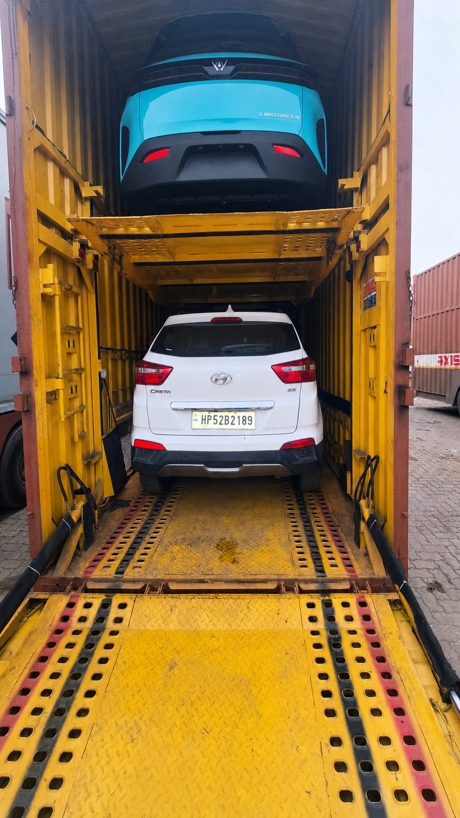 Two decks, two colours - a Tata Nexon and a Hyundai Creta sharing the run.