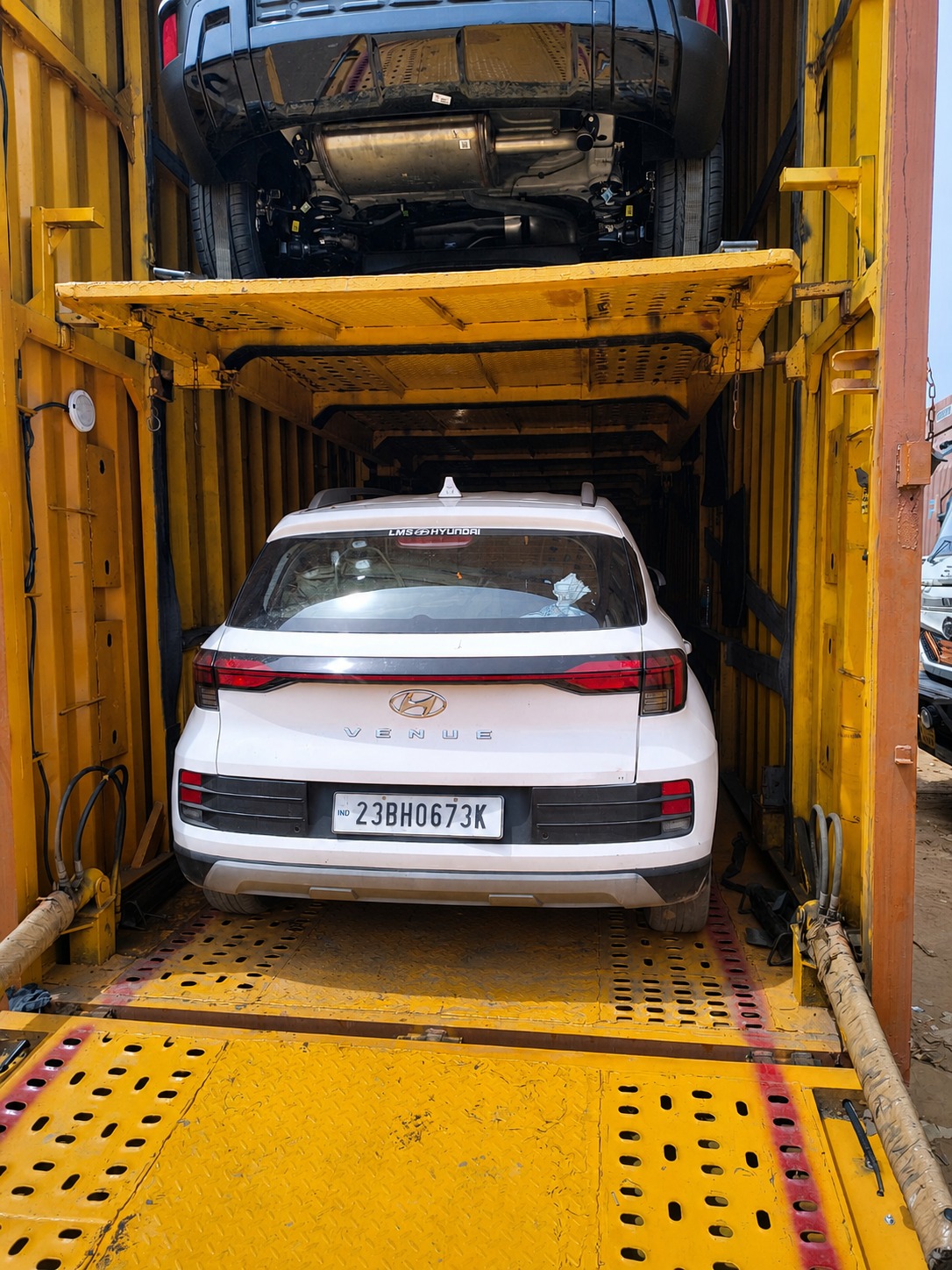 Hyundai Venue, lower deck, headed out on a two-car container.